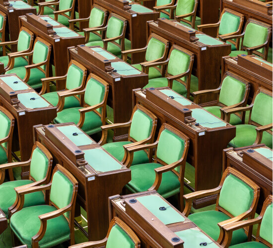 MP chairs and desks in the House of Commons chamber